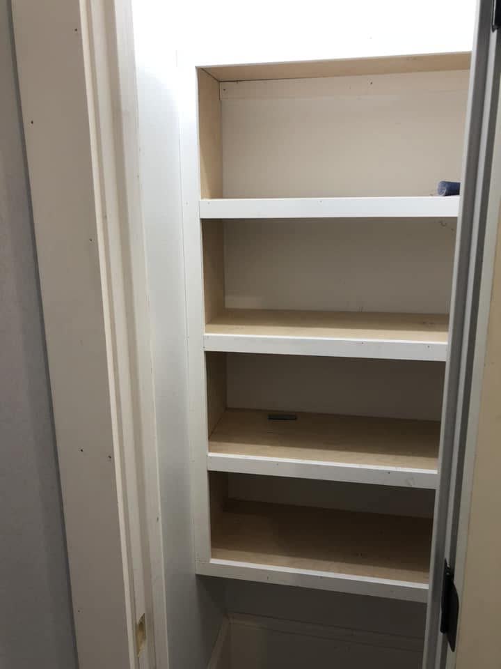 A built-in shelf niche framed into a wall.